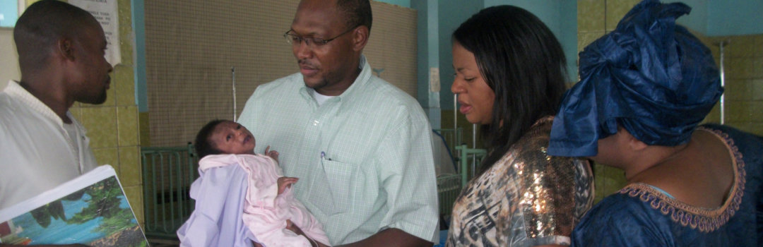 man carrying a baby