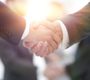 Two businessmen individual engage in a hand shaking