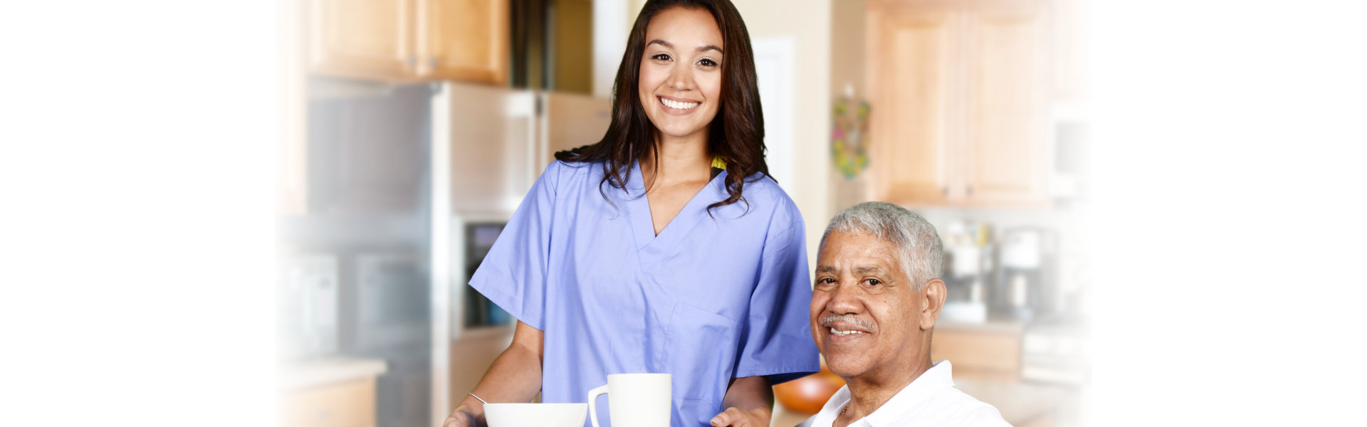 Senior and caregiver smiling