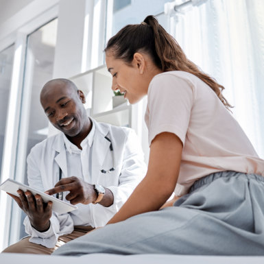 a doctor giving perscription on patient