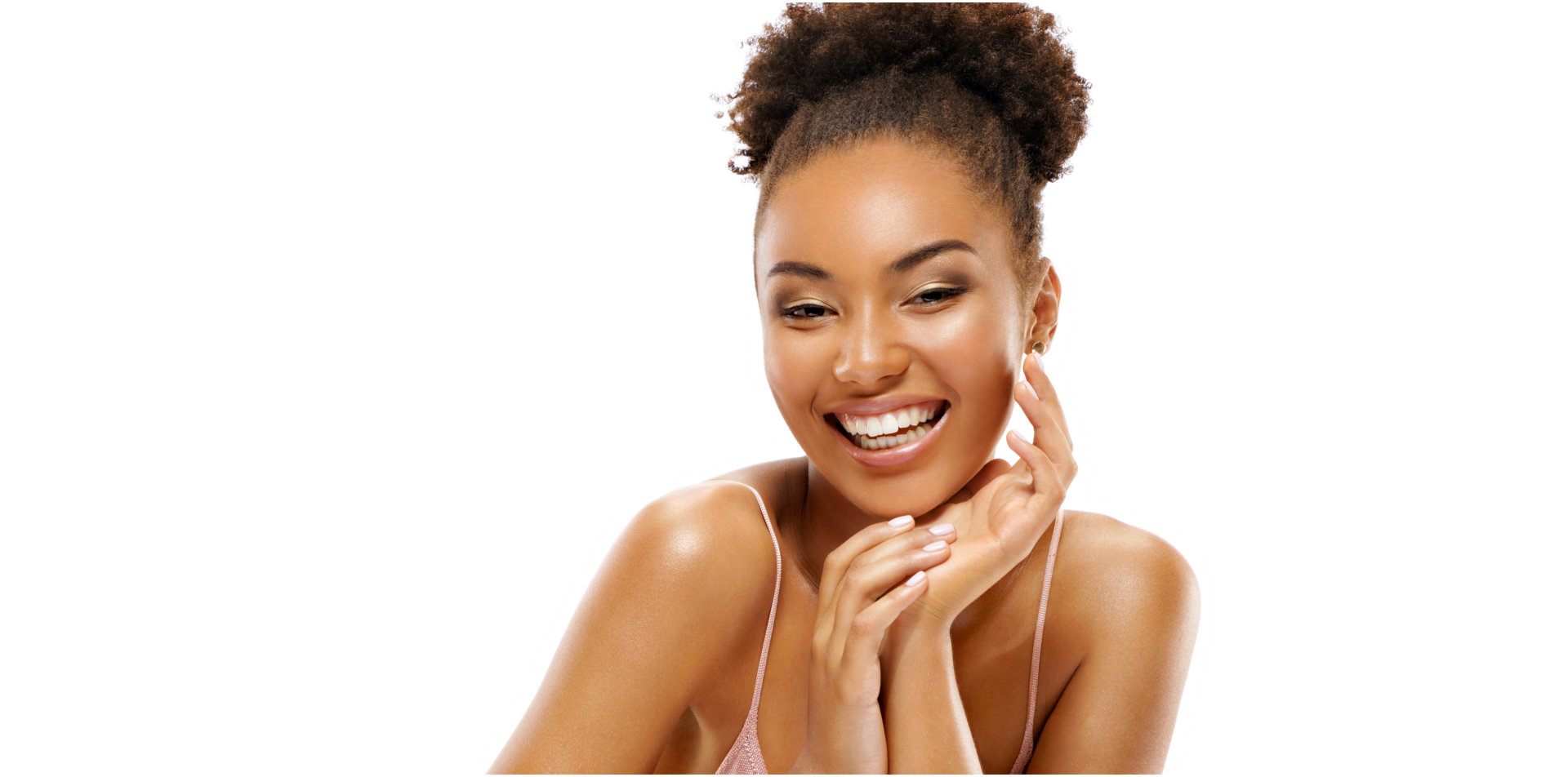 a woman smiling flexing her face glow