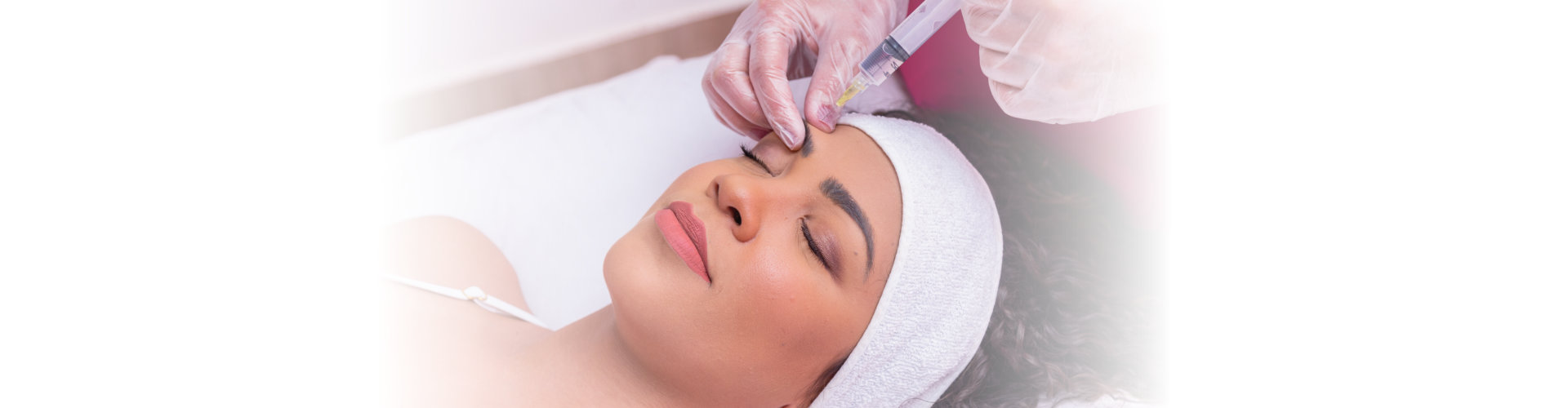 a woman is getting a rejuvenating facial injections