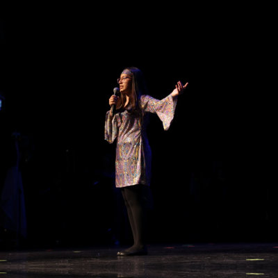 student talking to a microphone