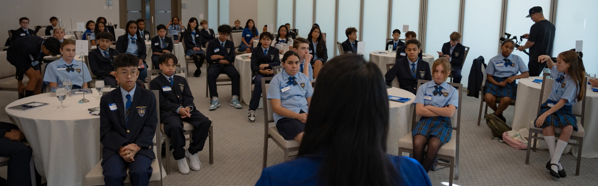 students listening to school staff talking