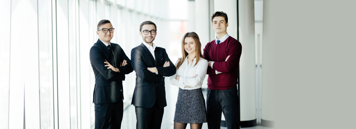 men and woman formally dressed standing side by side