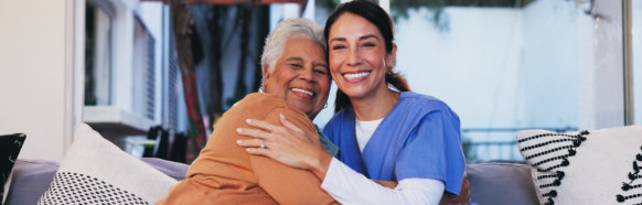 caregiver and senior smiling