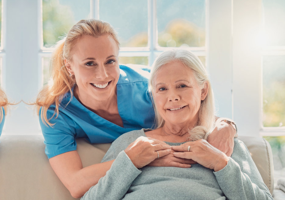 caregiver and elderly smiling