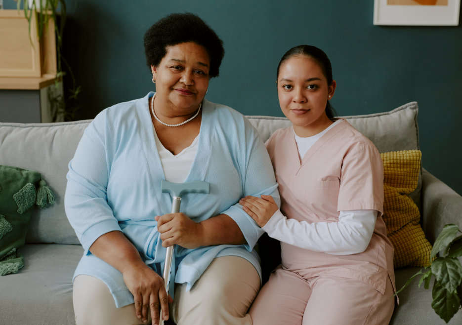 caregiver and elderly smiling