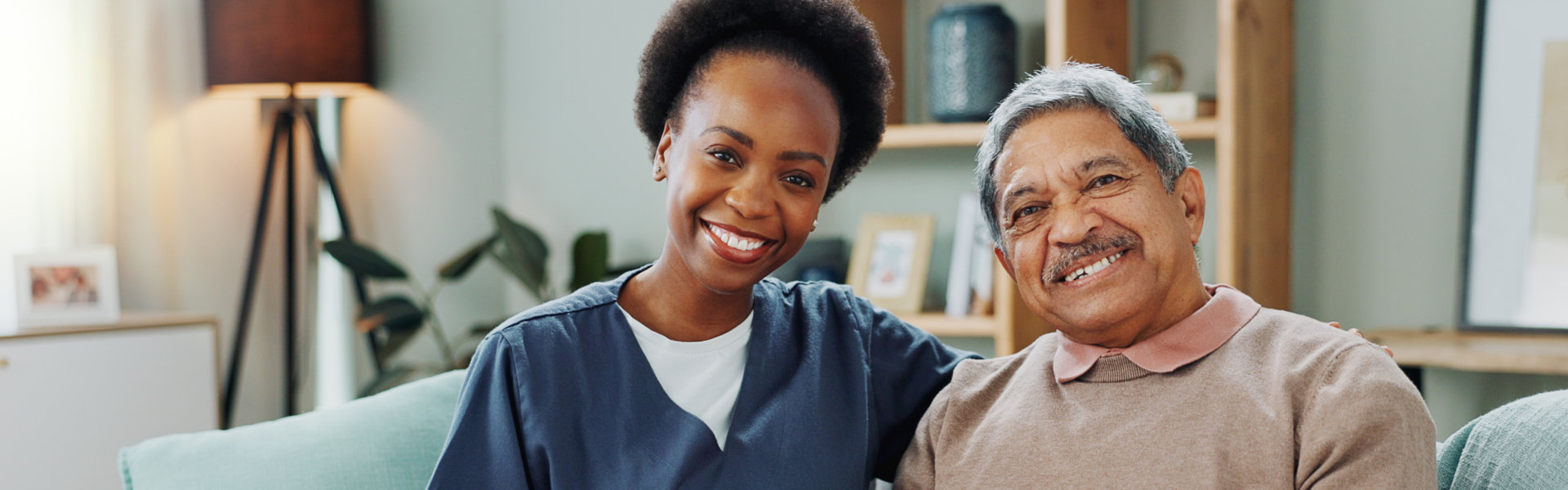 caregiver and elderly smiling