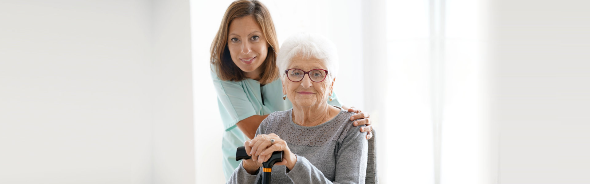 caregiver and senior smiling