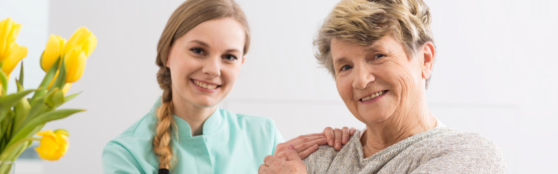 caregiver and senior smiling