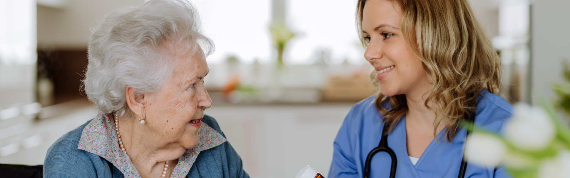 caregiver and elderly woman talking