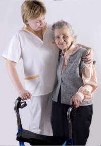 a woman caregiver hugging the senior woman