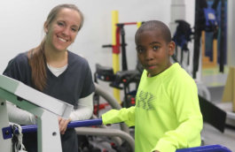 student and teacher smiling