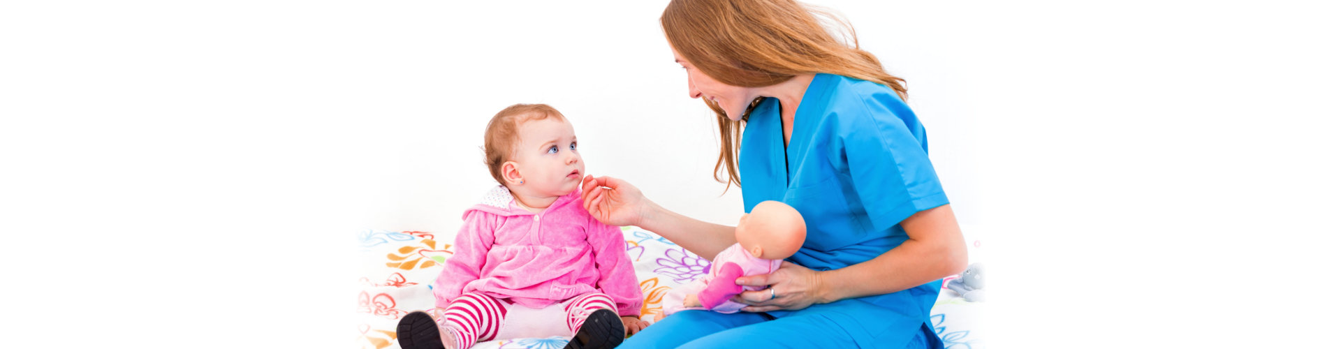 woman teaching a baby girl