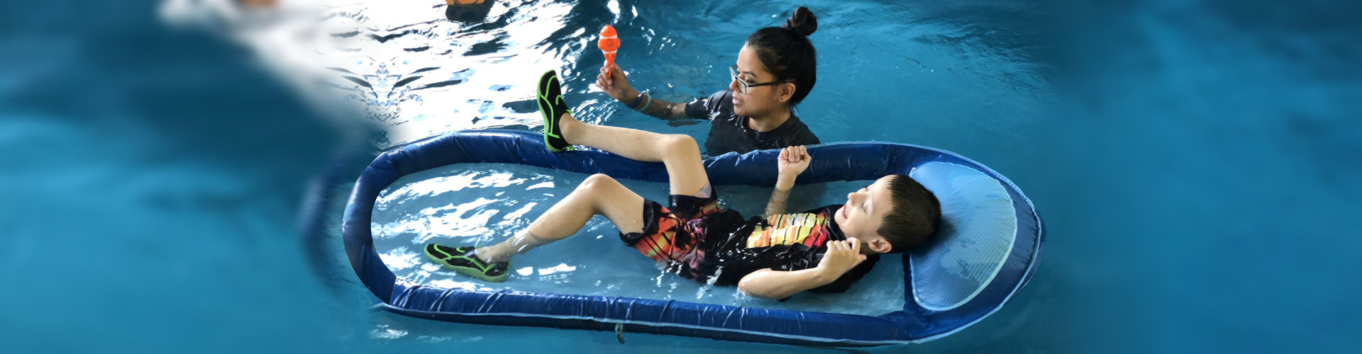 woman and a boy on pool