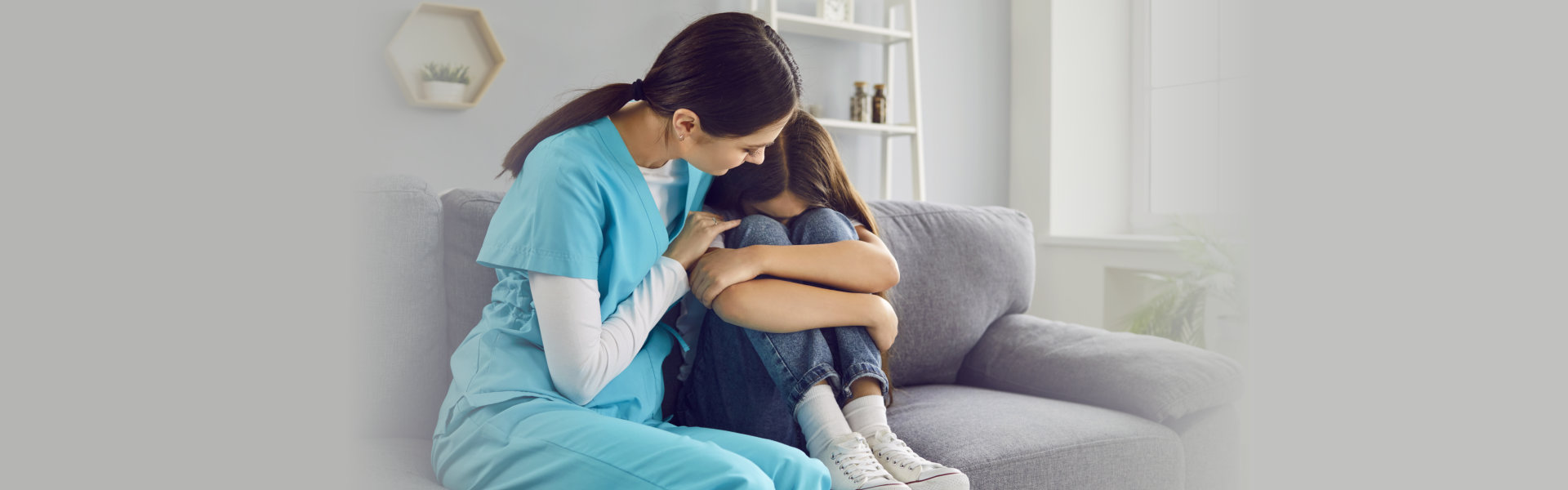 a nurse comforting her patient