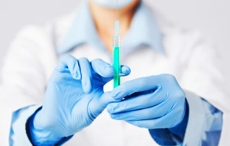 doctor showing a filled syringe