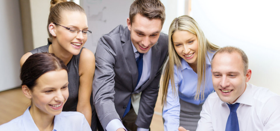 Business team with monitor having discussion