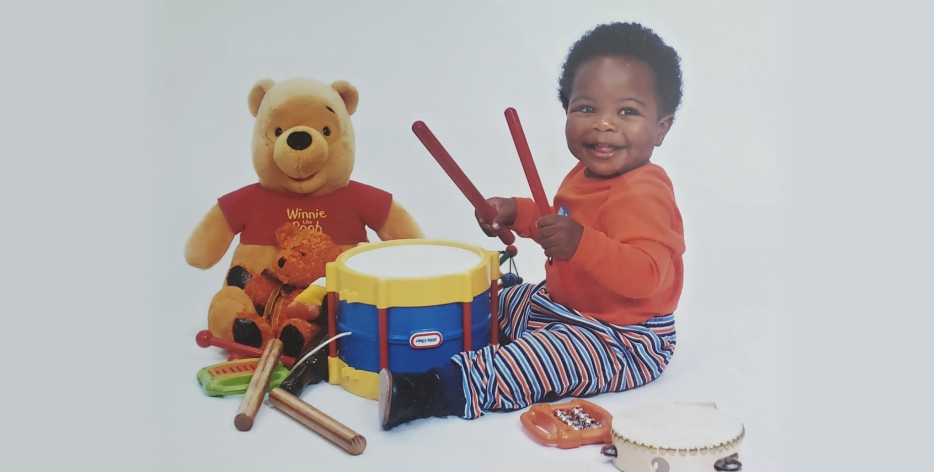 child playing with drums
