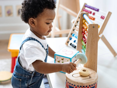 little boy playing with toy