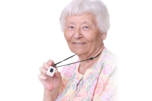 Happy Senior woman wearing a medical emergency panic button pendant